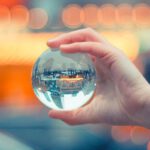 Interaction - Person Holding Round Glass Ball Macro Shot