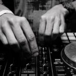 DJ - Grayscale Photography of Person Using Dj Controller