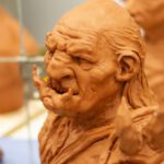 Genres - Earthen figurine of angry fictional creatures