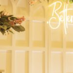 Venues - A wedding reception with flowers on the wall