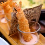 Food Trends - A tray of food with shrimp and salad on it