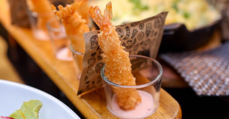 Food Trends - A tray of food with shrimp and salad on it