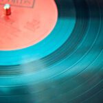 Music - Blue Vinyl Record Playing on Turntable