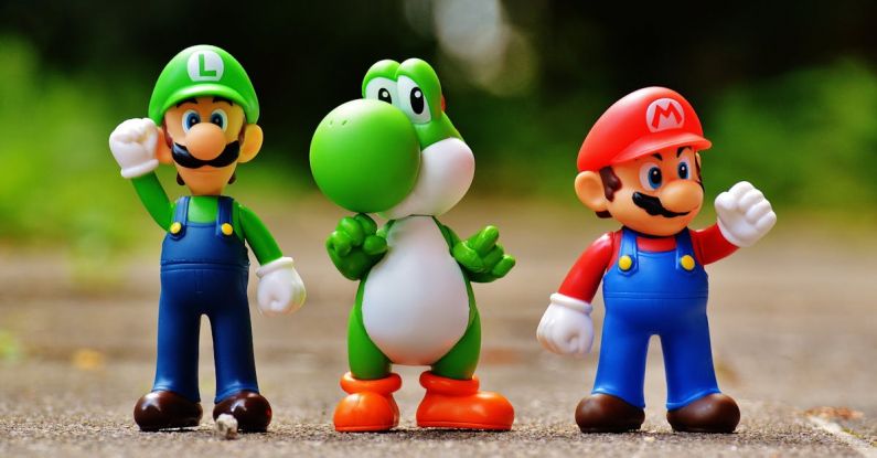 Games - Focus Photo of Super Mario, Luigi, and Yoshi Figurines