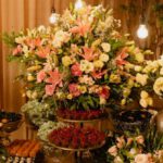 Floral Arrangements - Floral Arrangements and Bottles of Essential Oils on Wooden Table