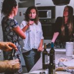 Socializing - Men and Women Standing Infront of Dining Table