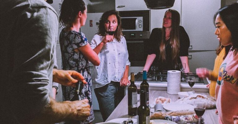 Socializing - Men and Women Standing Infront of Dining Table